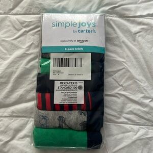 Brand new, never been opened package of Carter’s  boys briefs. 8 pairs, size M.
